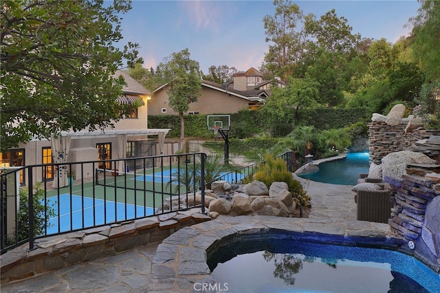 6137 Paseo La Vis, Woodland Hills, CA 91367 - pool at dusk featuring an outdoor pool