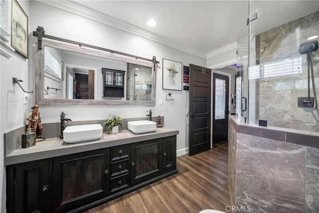 780 S Briargate Ln, Covina, CA 91723 - full bath with ornamental molding, a shower stall, double vanity, and wood finished floors