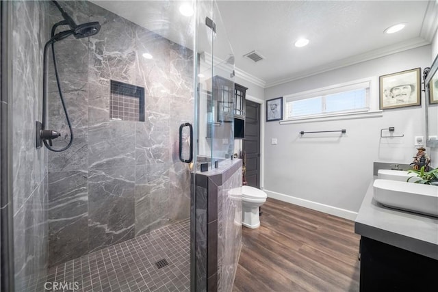 780 S Briargate Ln, Covina, CA 91723 - bathroom with double vanity, ornamental molding, wood finished floors, a marble finish shower, and recessed lighting