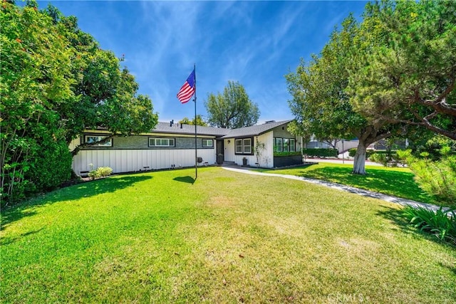 780 S Briargate Ln, Covina, CA 91723 - ranch-style home with a front lawn and board and batten siding