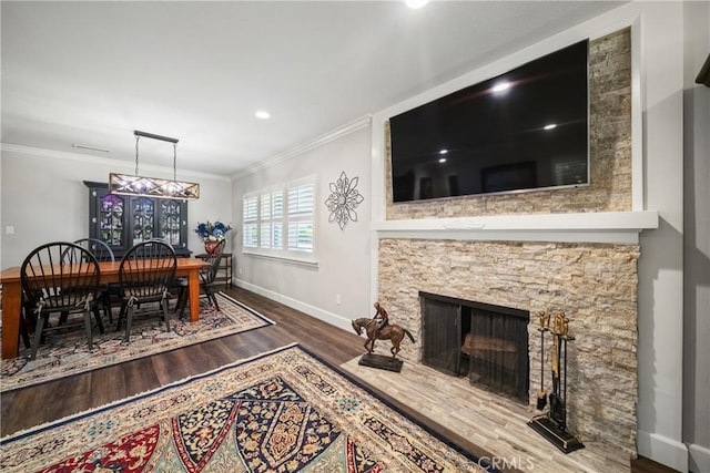 780 S Briargate Ln, Covina, CA 91723 - dining space with wood finished floors, crown molding, a fireplace, and recessed lighting