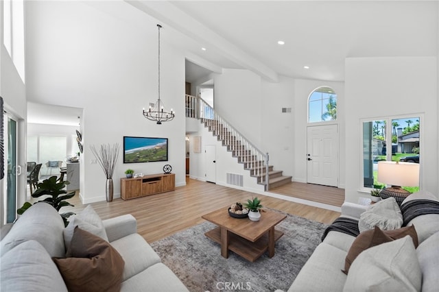 41442 Avenida De La Reina, Temecula, CA 92592 - living room featuring high vaulted ceiling, stairs, a chandelier, light wood-type flooring, and recessed lighting