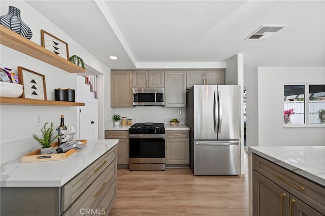 41442 Avenida De La Reina, Temecula, CA 92592 - kitchen with stainless steel appliances, open shelves, light wood-style flooring, light stone counters, and recessed lighting