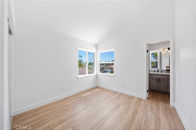 41442 Avenida De La Reina, Temecula, CA 92592 - unfurnished bedroom featuring light wood-style floors, high vaulted ceiling, and ensuite bathroom