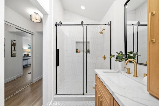 41442 Avenida De La Reina, Temecula, CA 92592 - full bath featuring wood finished floors, vanity, a stall shower, and vaulted ceiling