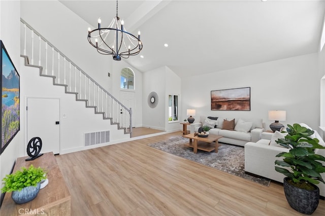 41442 Avenida De La Reina, Temecula, CA 92592 - living area featuring high vaulted ceiling, wood finished floors, stairway, a chandelier, and beamed ceiling