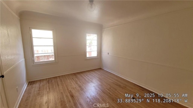 805 S Crane Ave, Compton, CA 90221 - empty room with wood finished floors and baseboards