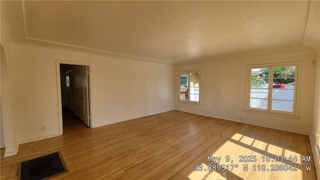 805 S Crane Ave, Compton, CA 90221 - empty room with healthy amount of natural light and wood finished floors