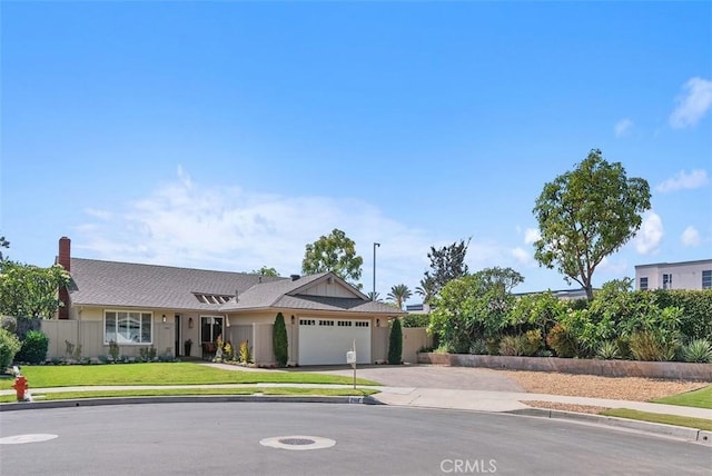 2168 N Agate St, Orange, CA 92867 - ranch-style house with concrete driveway, an attached garage, and a chimney