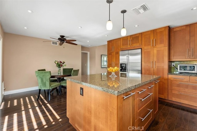 2168 N Agate St, Orange, CA 92867 - kitchen featuring stainless steel refrigerator with ice dispenser, brown cabinetry, dark wood-type flooring, a kitchen island, and recessed lighting