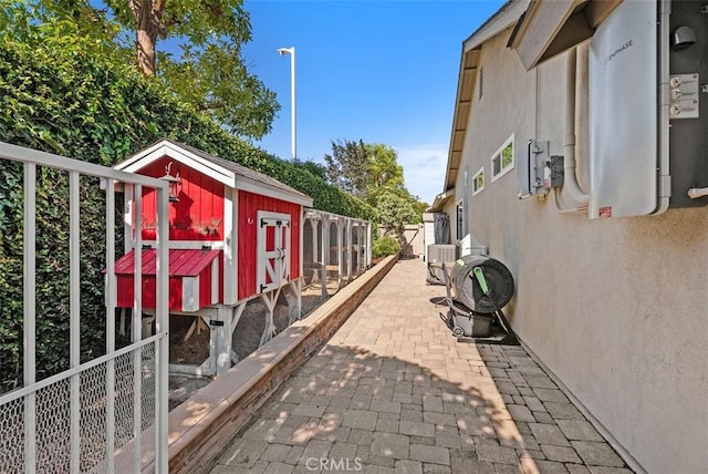 2168 N Agate St, Orange, CA 92867 - view of property exterior featuring exterior structure, an outbuilding, and stucco siding