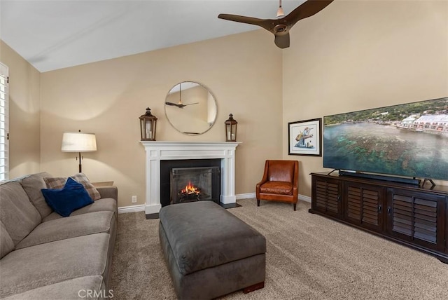 2168 N Agate St, Orange, CA 92867 - carpeted living room featuring a fireplace with flush hearth, ceiling fan, and lofted ceiling