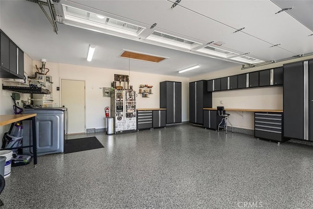 2168 N Agate St, Orange, CA 92867 - garage with washer / dryer and baseboards