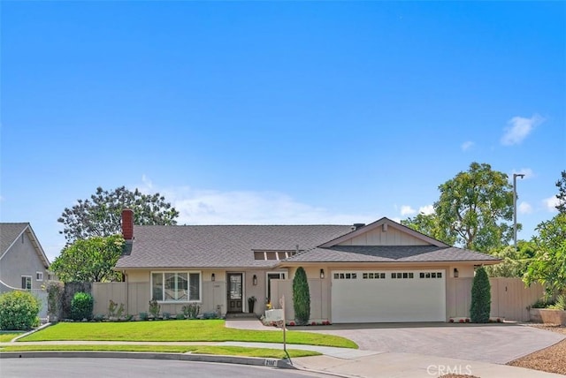 2168 N Agate St, Orange, CA 92867 - view of front of property featuring an attached garage, driveway, a chimney, board and batten siding, and roof with shingles