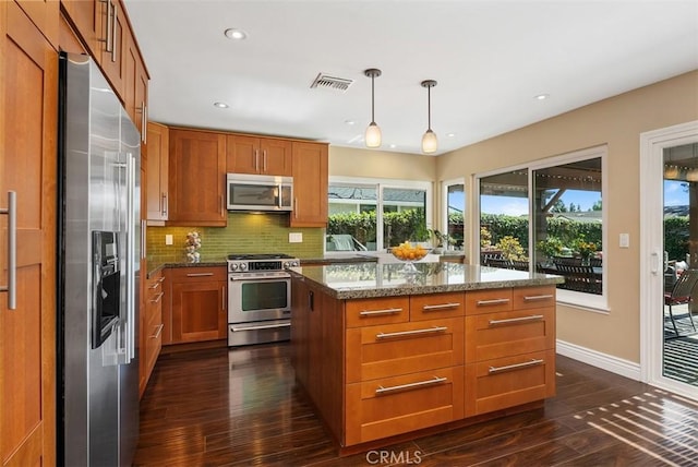 2168 N Agate St, Orange, CA 92867 - kitchen with appliances with stainless steel finishes, dark wood-type flooring, brown cabinetry, and recessed lighting