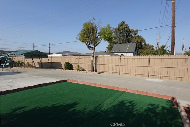 1063 Quarry St, Corona, CA 92879 - fenced backyard with a patio