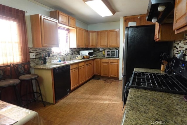 1063 Quarry St, Corona, CA 92879 - kitchen with black dishwasher, tasteful backsplash, gas range oven, extractor fan, and light stone counters