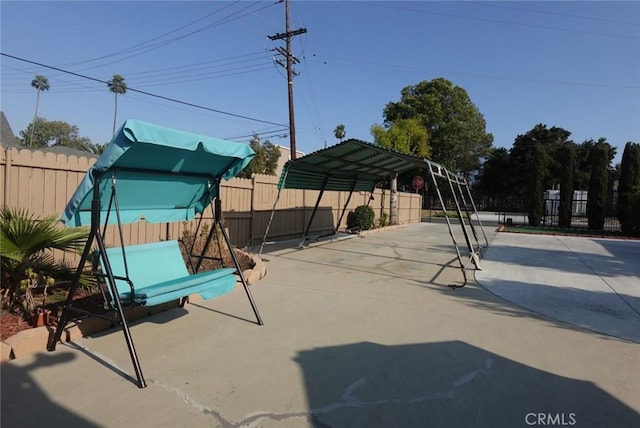 1063 Quarry St, Corona, CA 92879 - view of patio / terrace featuring a detached carport and driveway