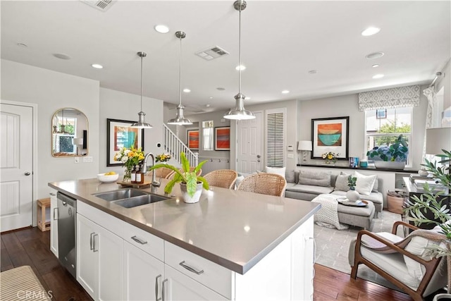 22088 Barrington Way, Saugus, CA 91350 - kitchen with dishwasher, dark wood finished floors, a kitchen island with sink, recessed lighting, and white cabinets