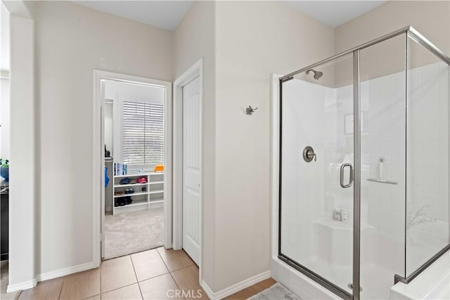 22088 Barrington Way, Saugus, CA 91350 - bathroom with a stall shower, a walk in closet, and tile patterned floors
