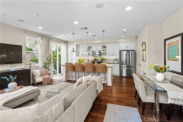 22088 Barrington Way, Saugus, CA 91350 - living area with dark wood-style flooring and recessed lighting