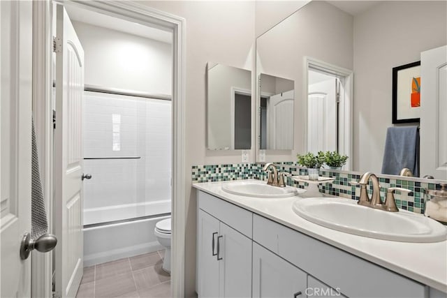 22088 Barrington Way, Saugus, CA 91350 - bathroom featuring double vanity, combined bath / shower with glass door, and decorative backsplash