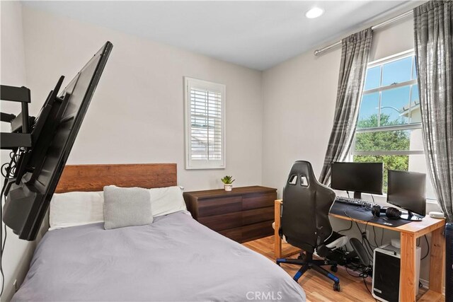 22088 Barrington Way, Saugus, CA 91350 - bedroom with multiple windows, light wood-style floors, a desk, and recessed lighting