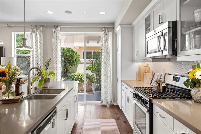 22088 Barrington Way, Saugus, CA 91350 - kitchen featuring stainless steel appliances, glass insert cabinets, dark wood-style flooring, white cabinets, and recessed lighting