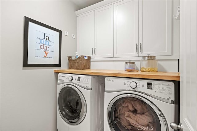22088 Barrington Way, Saugus, CA 91350 - laundry area featuring washer and dryer and cabinet space