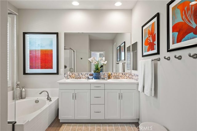 22088 Barrington Way, Saugus, CA 91350 - bathroom featuring double vanity, a garden tub, a stall shower, and recessed lighting