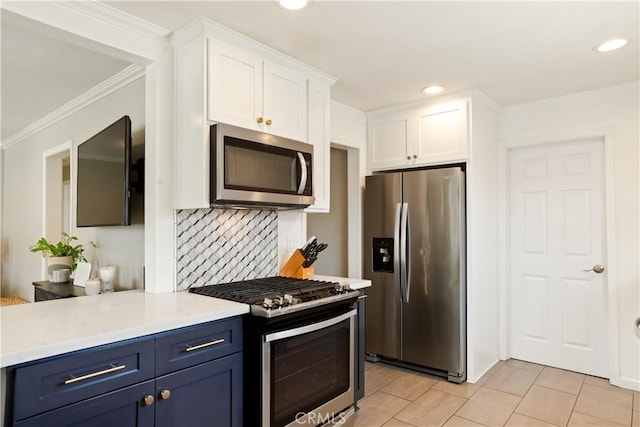 817 Caballo Ave, Glendora, CA 91740 - kitchen with appliances with stainless steel finishes, white cabinetry, light countertops, tasteful backsplash, and blue cabinets