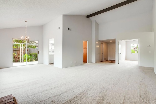 3694 Branch Ct, Oceanside, CA 92058 - unfurnished living room with high vaulted ceiling, light colored carpet, plenty of natural light, a chandelier, and beam ceiling