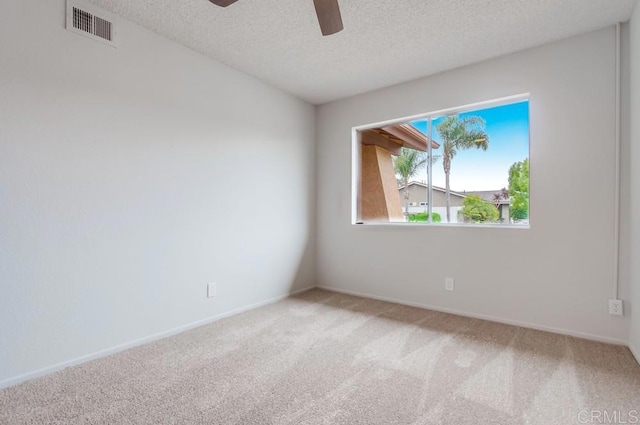 3694 Branch Ct, Oceanside, CA 92058 - spare room featuring light colored carpet, ceiling fan, and a textured ceiling