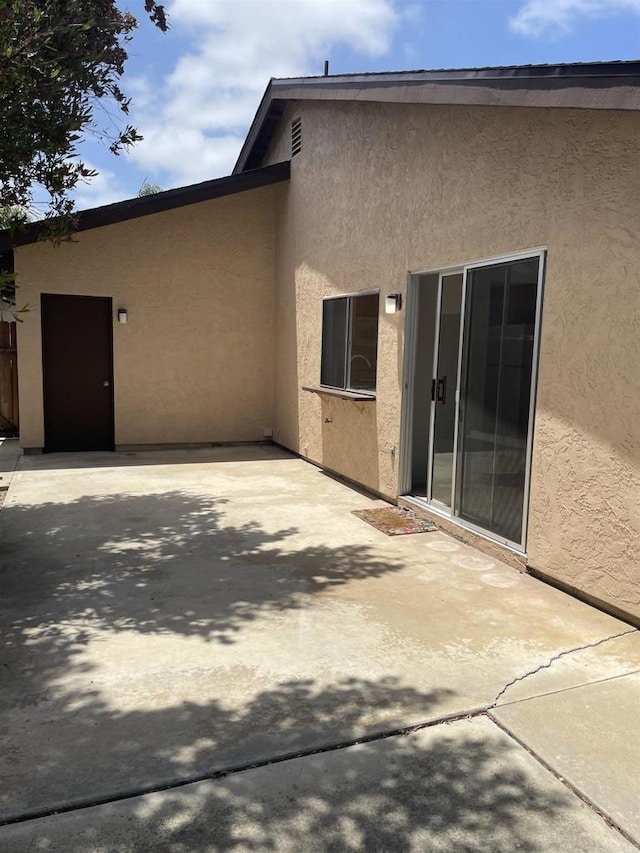 3694 Branch Ct, Oceanside, CA 92058 - back of property featuring stucco siding and a patio area