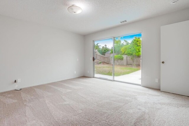 3694 Branch Ct, Oceanside, CA 92058 - carpeted empty room featuring a textured ceiling