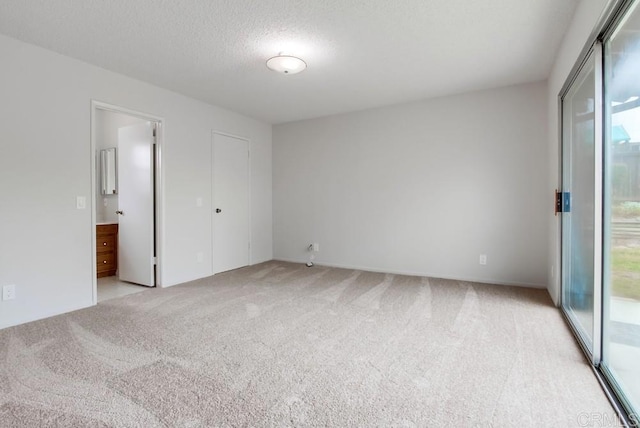 3694 Branch Ct, Oceanside, CA 92058 - unfurnished bedroom with light colored carpet, access to exterior, a textured ceiling, and ensuite bathroom