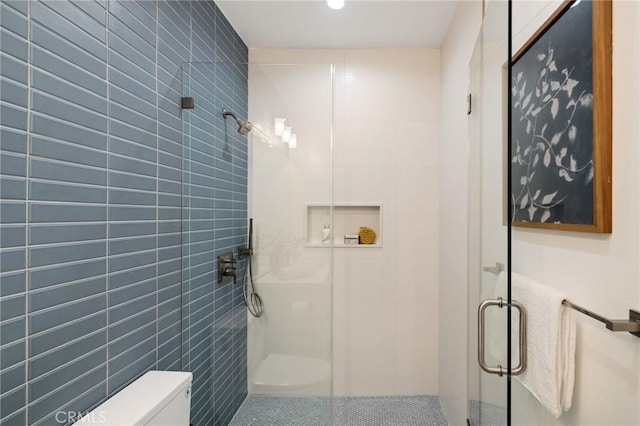 1700 Perkins Ln, Redondo Beach, CA 90278 - bathroom featuring a stall shower, tile walls, and recessed lighting
