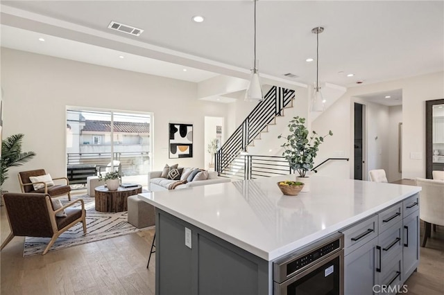 1700 Perkins Ln, Redondo Beach, CA 90278 - kitchen featuring open floor plan, light wood finished floors, gray cabinets, light countertops, and recessed lighting