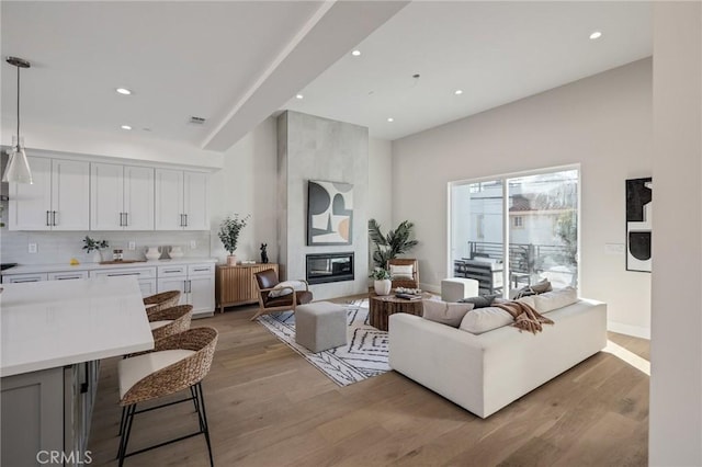 1700 Perkins Ln, Redondo Beach, CA 90278 - living room with light wood-style flooring, recessed lighting, and a large fireplace