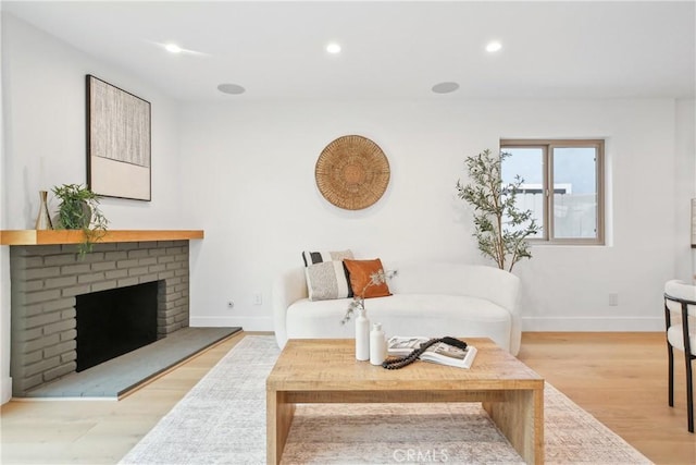 1147 Charleston St, Costa Mesa, CA 92626 - living area featuring wood finished floors, recessed lighting, and a fireplace
