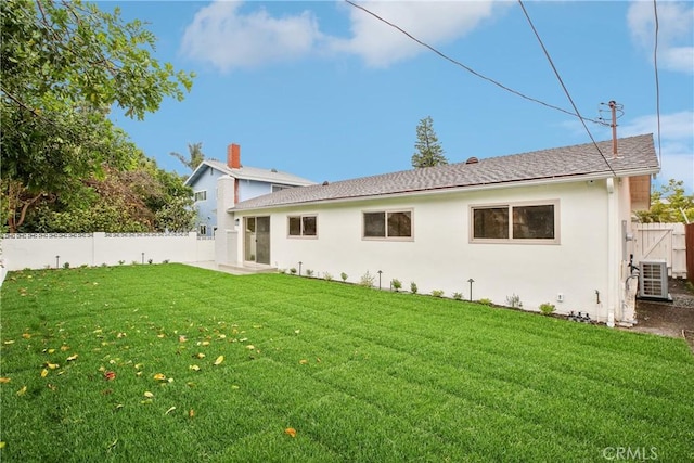 1147 Charleston St, Costa Mesa, CA 92626 - back of property featuring a fenced backyard, stucco siding, and a shingled roof
