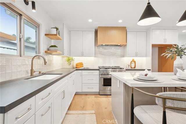 1147 Charleston St, Costa Mesa, CA 92626 - kitchen with high end stainless steel range oven, premium range hood, white cabinets, and recessed lighting