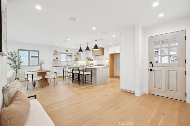 1147 Charleston St, Costa Mesa, CA 92626 - living room with recessed lighting and light wood-style floors