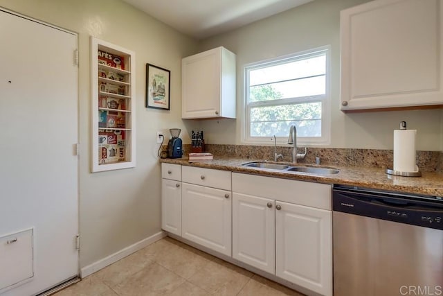 730 S 31st St, San Diego, CA 92113 - kitchen with stainless steel dishwasher, white cabinetry, light tile patterned floors, and stone counters