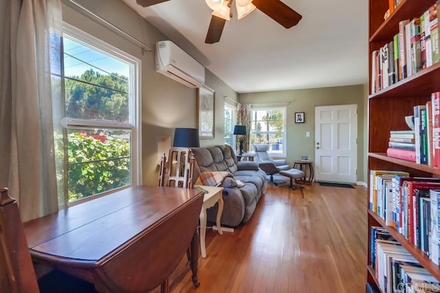 730 S 31st St, San Diego, CA 92113 - living room with a wall mounted air conditioner, a ceiling fan, and wood finished floors