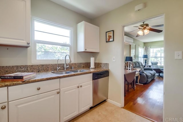 730 S 31st St, San Diego, CA 92113 - kitchen featuring stainless steel dishwasher, ceiling fan, stone countertops, and white cabinets