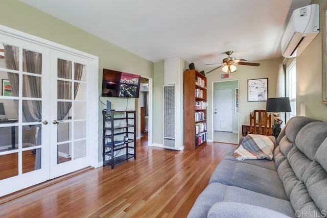 730 S 31st St, San Diego, CA 92113 - living area featuring french doors, an AC wall unit, ceiling fan, wood finished floors, and a heating unit