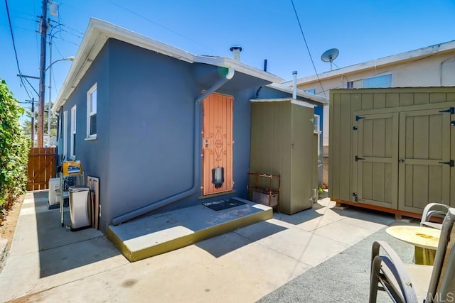 730 S 31st St, San Diego, CA 92113 - back of property featuring a storage shed and stucco siding
