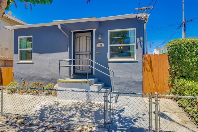 730 S 31st St, San Diego, CA 92113 - view of front of home featuring stucco siding and a gate