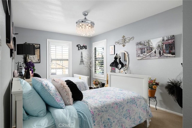 2350 Claudia St, Corona, CA 92882 - carpeted bedroom featuring a chandelier and baseboards